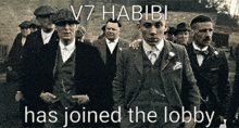 v7 habibi has joined the lobby with a group of men in suits and hats