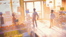 a group of people are standing in a store with the sun shining through the window .