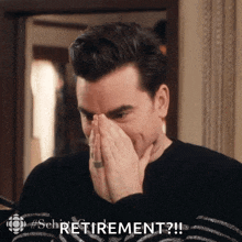 a man covering his mouth with his hands and the word retirement is visible