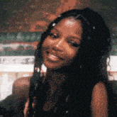 a close up of a woman 's face with a blurred background