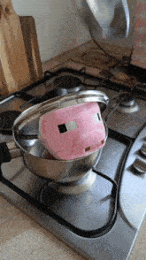 a stuffed pig is being cooked in a pot