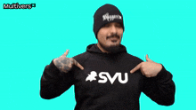 a man wearing a black hoodie with svu on it
