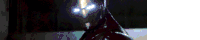 a close up of a person 's face with glowing eyes in the dark