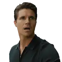 a man with a surprised look on his face wearing a black shirt