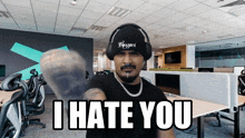 a man wearing headphones and a hat that says blizzard on it