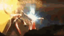 a blurred image of a person holding a light in their hand