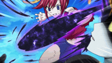 a girl with red hair is holding a black object in her hand