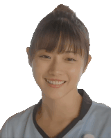 a woman with a bun on her head is smiling for the camera