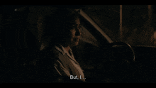 a woman in a car with the words but i on the bottom