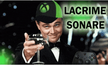 a man in a tuxedo is holding a glass of wine and wearing an xbox hat