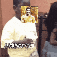a boy with a picture of a soccer player and the word afckingers on the bottom