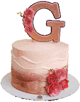 a cake with a letter g on top and pink roses