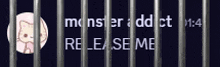 a picture of a cat behind bars with the words " monster addict release me "