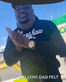 a man wearing a black shirt that says ' ns law ' on it
