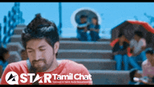 a star tamil chat advertisement with a man in a red shirt in the foreground