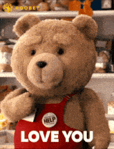 a teddy bear wearing a red apron with a button that says help