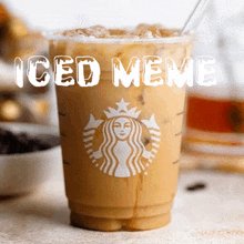 a cup of starbucks iced coffee with a straw