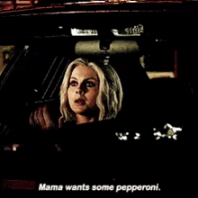 a woman in a car with the words mama wants some pepperoni on the bottom