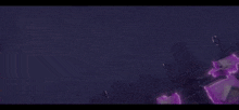 a purple light is coming out of a purple object .
