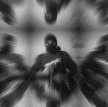 a blurry photo of a person with a mask on their face