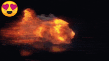 a smiley face with hearts in its eyes is next to a fire