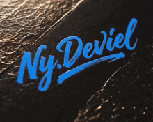 the name ny deriel is written in blue on a dark surface