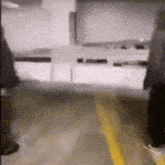 a blurry picture of people walking down a street