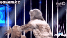 a gif of a woman being hugged by a man with the words @oriannafans23 on the bottom
