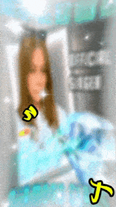 a blurry picture of a girl with a sticker that says s on it