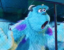 sulley from monsters inc is looking through a window