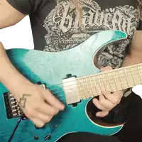 a man playing a guitar with a shirt that says ' heavy metal ' on it
