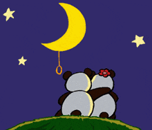 a couple of panda bears holding a crescent moon balloon