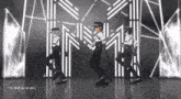 a man in a police uniform is dancing with the words " i 'm tied up to you " in the background
