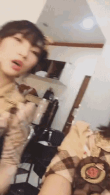a woman in a military uniform is standing in a room with her mouth open