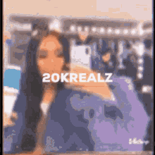 a blurry picture of a woman taking a selfie with the words 20krealz on the top
