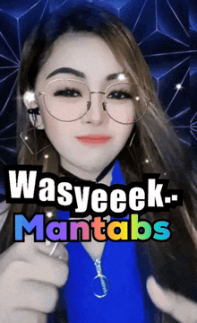 a woman wearing glasses and a blue shirt with the words wasyeeek-mantabs written above her