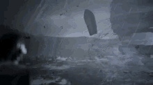 a boat is floating on top of a body of water .