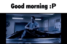a man is covering a dead body with a black bag and the words good morning : p