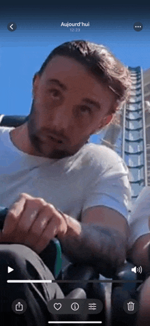 a video of a man on a roller coaster says aujourd 'hui