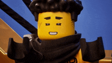 a close up of a lego character with a smiley face