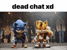 sonic the hedgehog and tails the fox are dancing in front of a crowd with the words dead chat xd above them