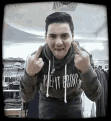 Guy With Gray Sweater Doing The Dirty Finger GIF