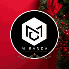 a logo for miranda arquitectura y construccion sits in front of a christmas wreath