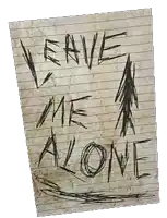 a piece of lined paper with the words `` leave me alone '' written on it .