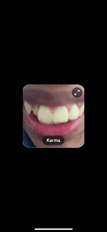 a close up of a person 's mouth with the word karma on the bottom right