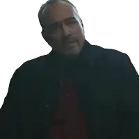 a man with a beard wearing a black jacket and red shirt