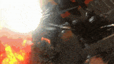 a group of people are standing in front of a large fire ..