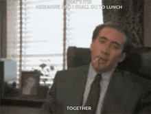 a man in a suit and tie is smoking a cigarette and saying " together "