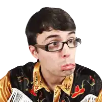 a young man wearing glasses and a cowboy shirt makes a funny face