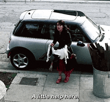 a woman standing in front of a car with the words " a little help here " written below her